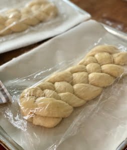 Braided Easter bread dough after 2nd proving on lined baking trays covered in cling film - Pure Maple 