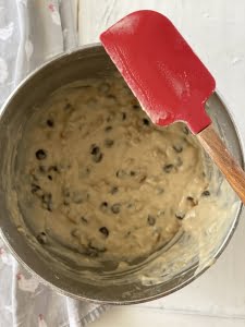 Raw Chocolate Chip Banana Nut Muffin mixture in mixing bowl