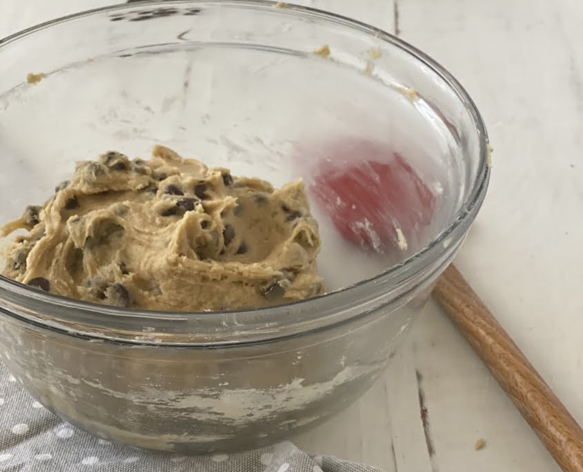 Chocolate Chip Cookie mix in bowl spatal to the of bowl