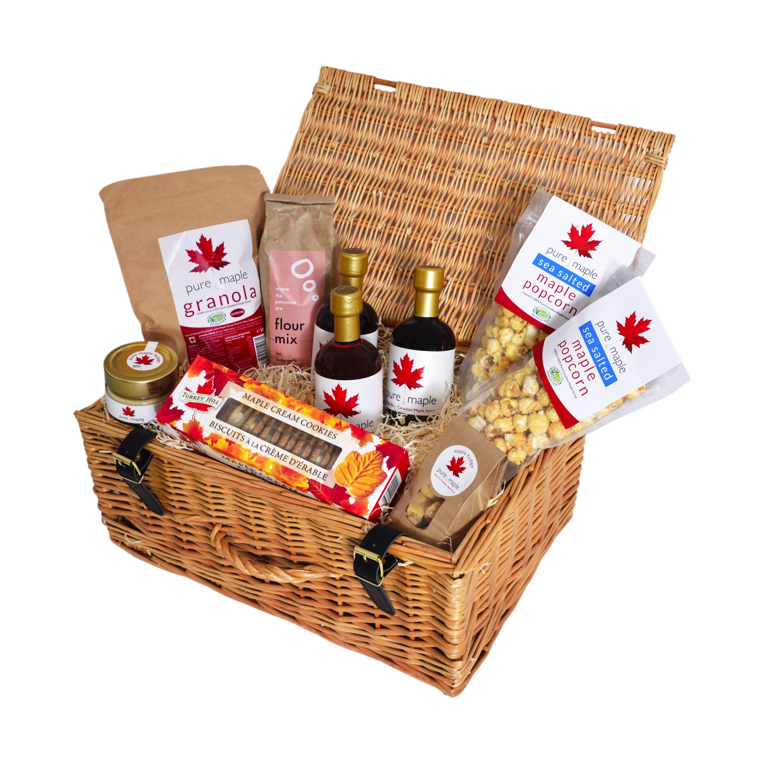 Christmas Hamper Gift Basket filled with maple syrup based products including 3 bottles of Pure Maple Syrup, jar of Pure Maple Butter, 2 bags of Pure Maple Sea Salted Popcorn, a bag of Pure Maple Fudge and many more maple products