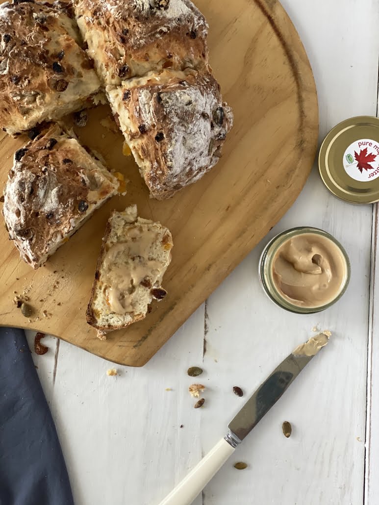 Maple Fruity Soda Bread with a quarter cut and a slice with Pure Maple Butter on it - Pure Maple