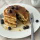 Lemon and Blueberry Ricotta Pancakes with a section cut out - Pure Maple