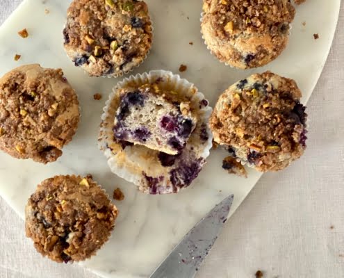 Maple Blueberry Muffins with Nutty Streusel Topping and 1 muffin cut in half - Pure Maple