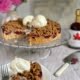 Plum cake with streusel topping and vanilla ice cream with a piece cut out - Pure Maple