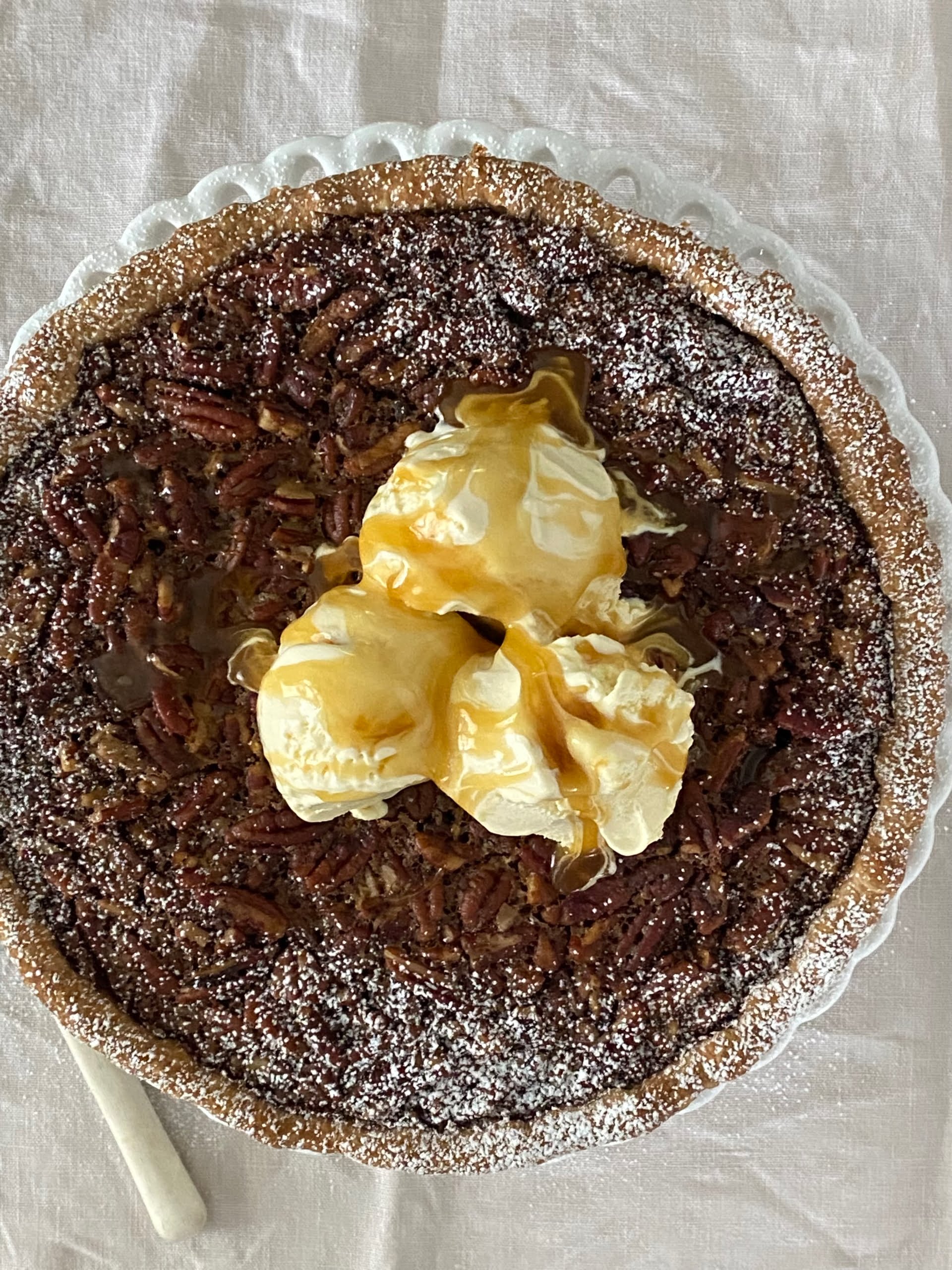 Maple Pecan Pie topped with vanilla ice cream and drizzled with Salted Maple Caramel - Pure Maple