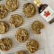 chocolate chip mocha cookies on wire rack with maple syrup bottle